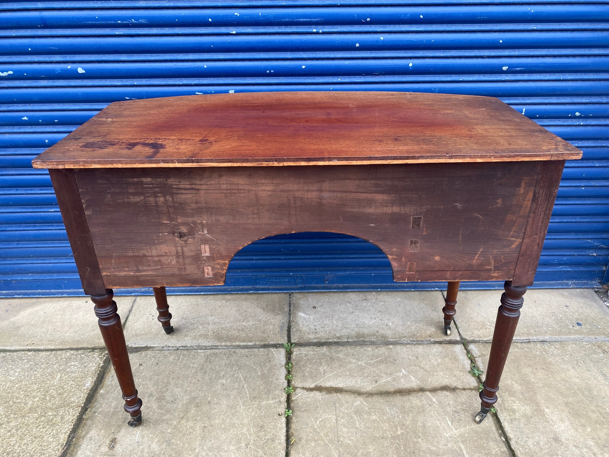 An early 19th Century mahogany bow fronted desk of a single drawer above two smaller drawers, raised - Image 7 of 8