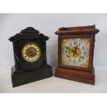 A late Victorian slate mantle clock and an Edwardian oak mantle clock.