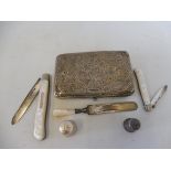 A Continental silver cigarette case, two silver and MOP handled fruit knives, thimble etc.