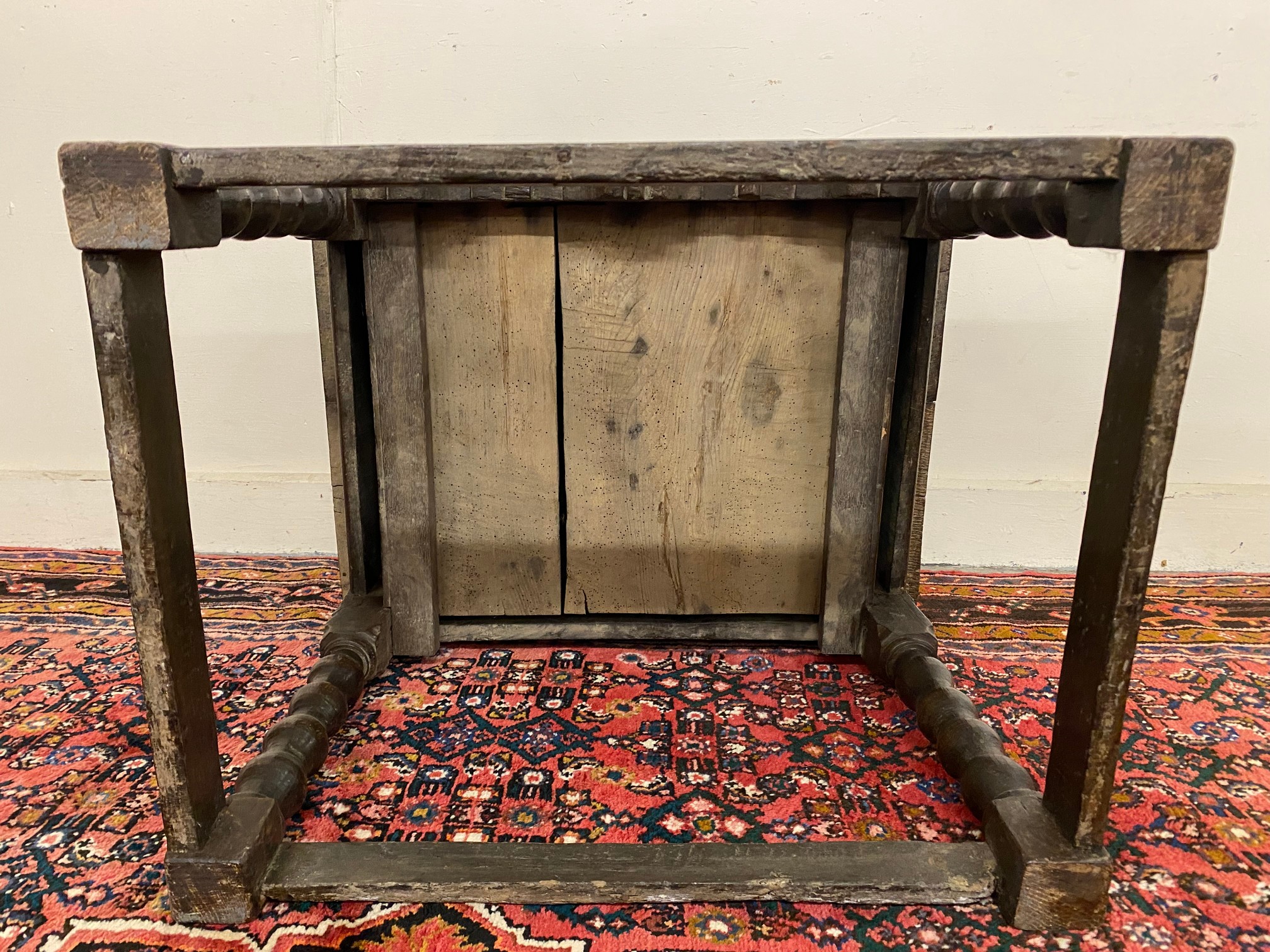A primitive 17th Century Welsh oak side table with bobbin supports, 30 1/2" w x 26" h x 23" d. - Image 12 of 15
