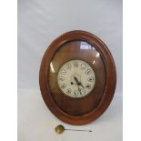 A 19th Century French vineyard clock, the mahogany case of oval form, enclosing a circular dial with
