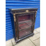 A 19th Century ebonised and brass mounted pier cabinet, with retailer's label to the back for