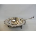 A good quality silver plated serving dishes raised upon three hoof supports, plus a white metal