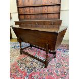 An 18th Century oak and possibly elm dough bin of excellent colour, raised upon turned supports