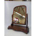 A Victorian mahogany swing mirror.