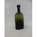 An early green glass bottle, 6" high.