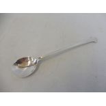 A hammered silver honey spoon, in the Arts and Crafts style, Sheffield 1932, maker C.B & S.