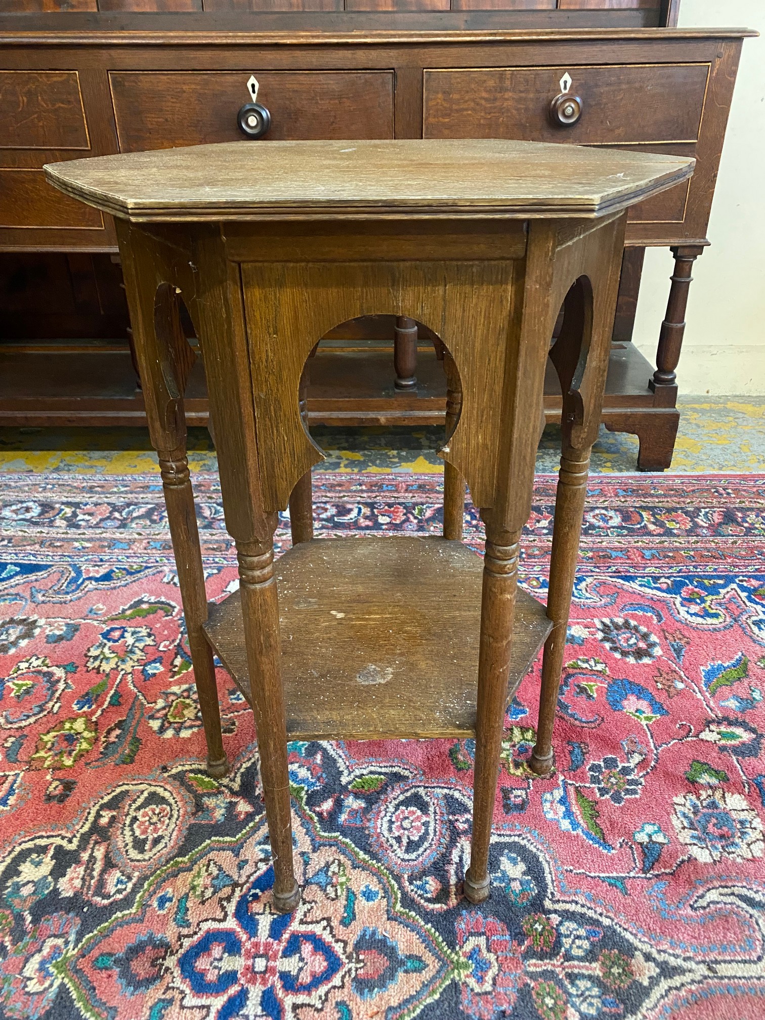 An Arts and Crafts oak hexagonal occasional table, of Eastern design influence, the top 21 1/2" at