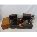 A quantity of oil lamp parts, painting packaging and various wooden boxes.