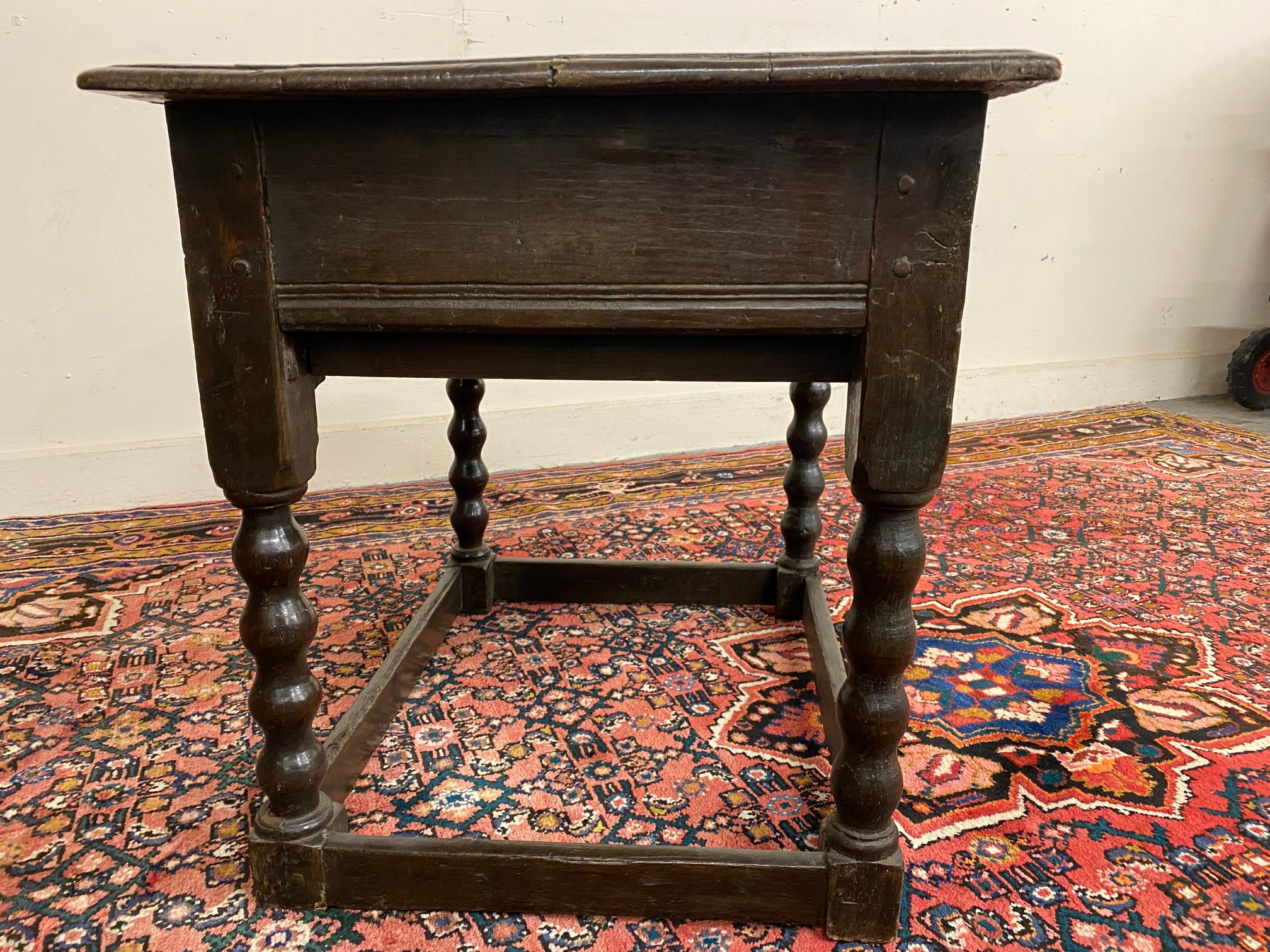 A primitive 17th Century Welsh oak side table with bobbin supports, 30 1/2" w x 26" h x 23" d. - Image 8 of 15