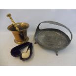 An early 19th Century brass mortar and pestle, an Arts and Crafts style pewter basket and a cased