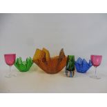 A large amber-coloured handkerchief glass bowl, two smaller, two cranberry drinking glasses and a