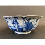 A Chinese blue and white bowl, decorated to the sides with ladies, four character mark to base,