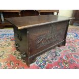 An early 20th Century oak blanket box of Arts and Crafts design with heavy handles to the side, 33