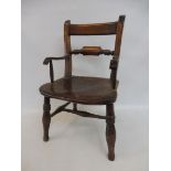 An elm seated child's Oxford style armchair.
