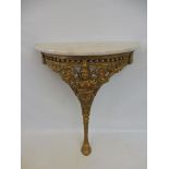 A marble topped semi-circular console table, 26" wide x 29" high x 11 1/2" deep.