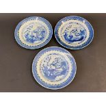 Three Chinese blue and white plates, decorated with buildings in a landscape, 19th Century, 9"