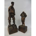 Two Bavarian carved wooden figures, one of a man drinking, the largest 15" high.