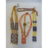 A selection of tribal beadwork, a yellow metal watch marked Royce to the dial and a cased Marvin