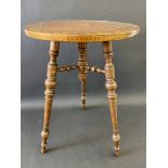 A very good quality 19th Century Moorish heavily inlaid circular occasional table raised on three