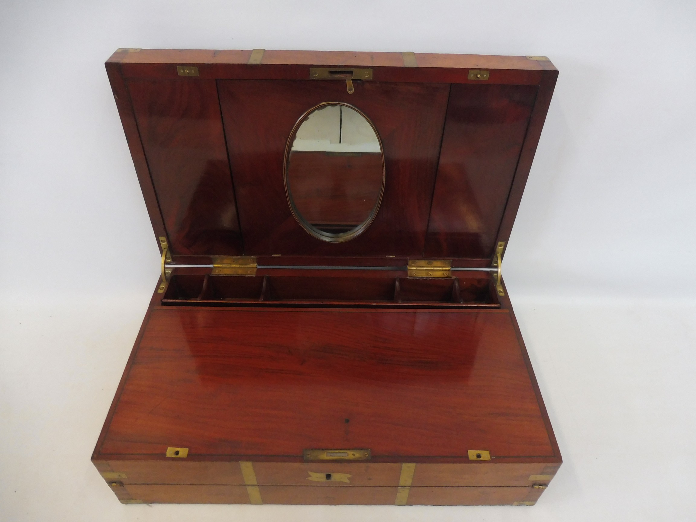 A fine quality 19th Century mahogany and brass bound campaign writing slope, the inset brass