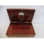 A fine quality 19th Century mahogany and brass bound campaign writing slope, the inset brass