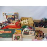 A selection of Christmas decorations and various old games.