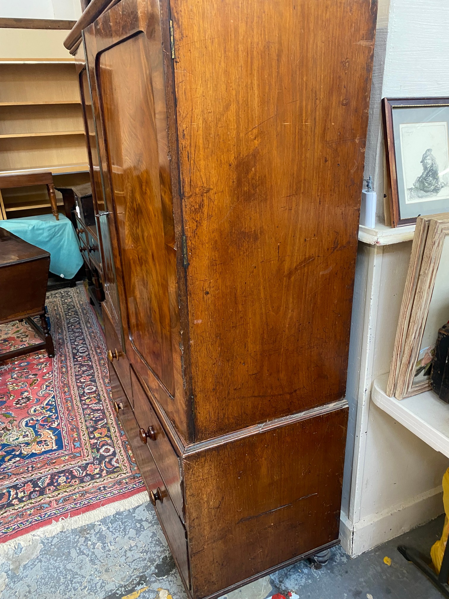 An early 19th Century mahogany linen press of two panelled doors enclosing slides, above a three - Image 4 of 8