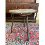 A rare 19th Century or possibly earlier Welsh borders cricket table with a fruitwood top and ash