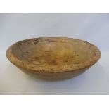 A large early 19th Century Welsh turned sycamore dairy bowl with old repairs, 17" diameter.