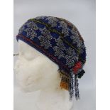 An unusual beadwork encrusted cap, possibly 1930s.