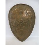 A decorative shield, 16 1/2 x 23".