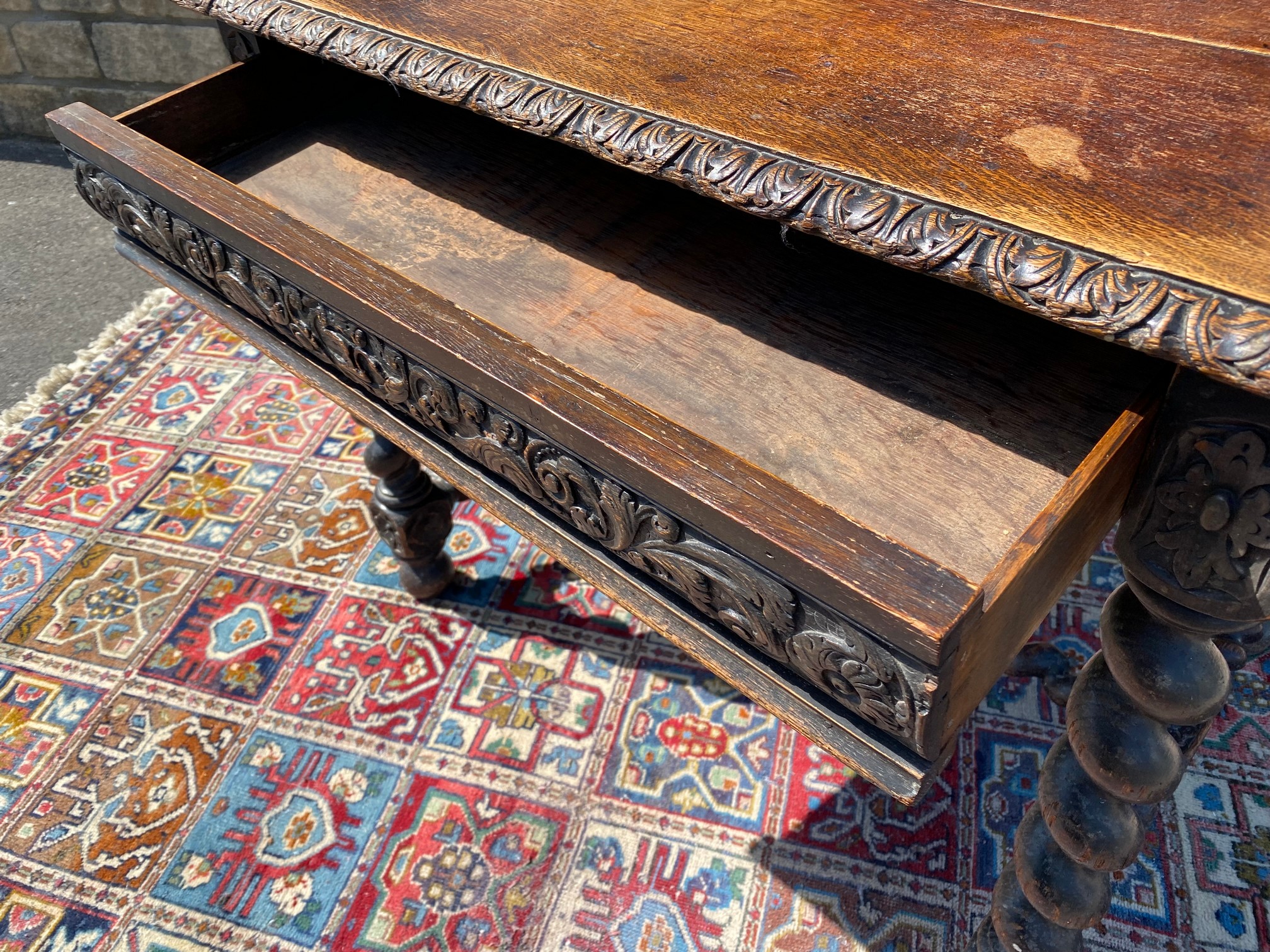 A Victorian carved oak single drawer side table raised upon barley twist supports joined by a - Image 3 of 4