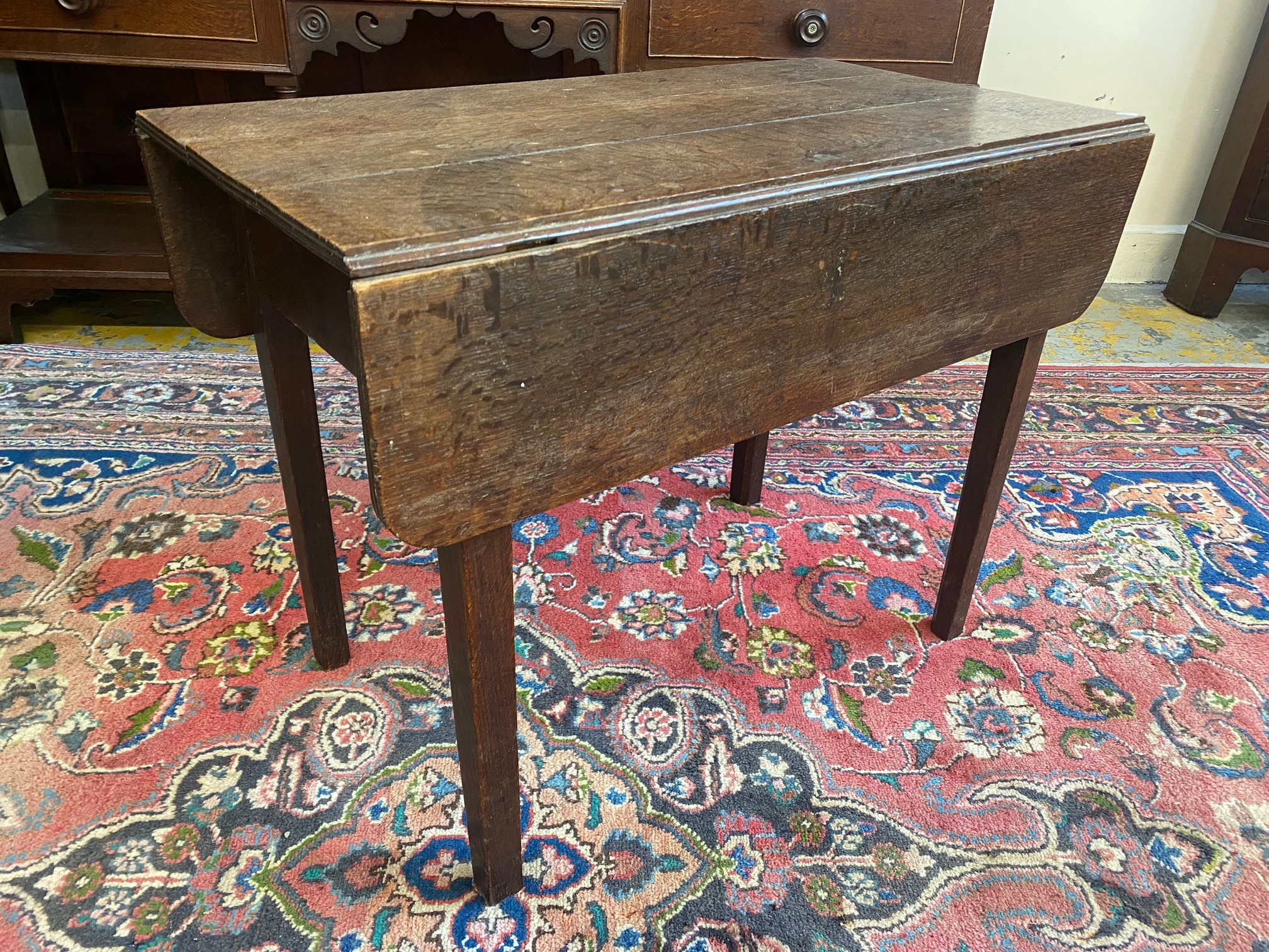 An unusual country made oak drop flap table, with hidden drawer, 30" wide x 23" high x 30 1/2"