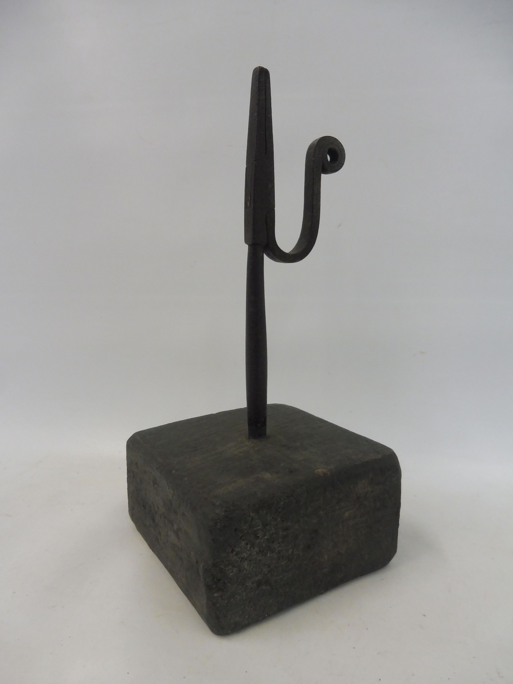 An early 19th Century primitive rushlight holder on a painted base, 8 1/2" h.