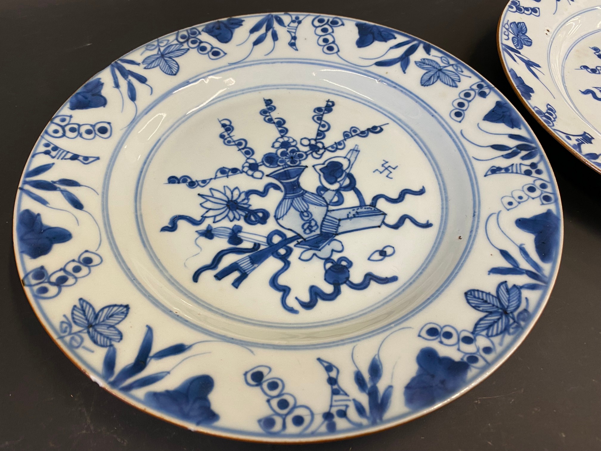 A pair of Chinese blue and white plates decorated with a vase of flowers to the centre, 19th Century - Image 2 of 4