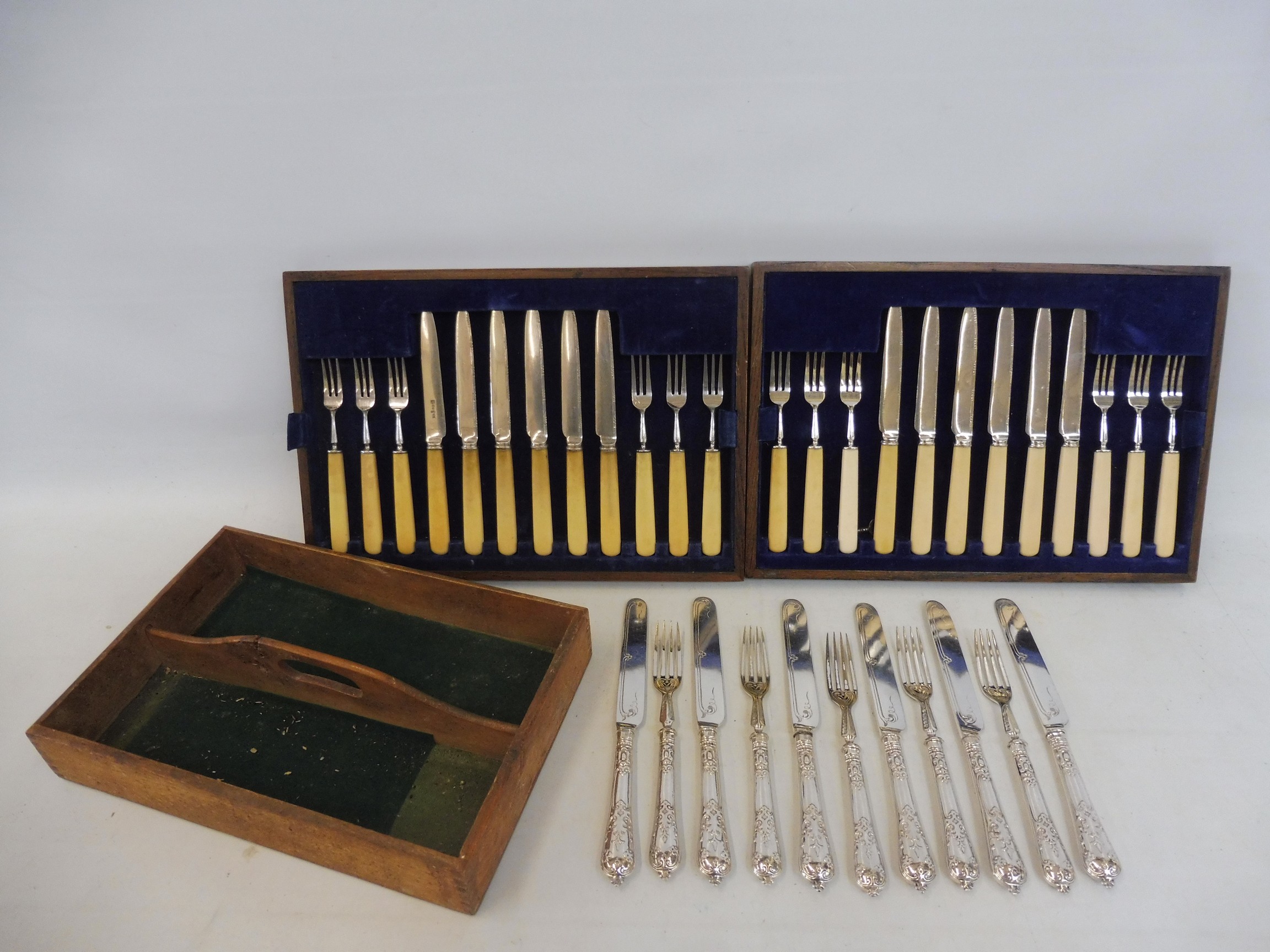 A selection of silver handled knives and forks plus a quantity of plated cutlery.