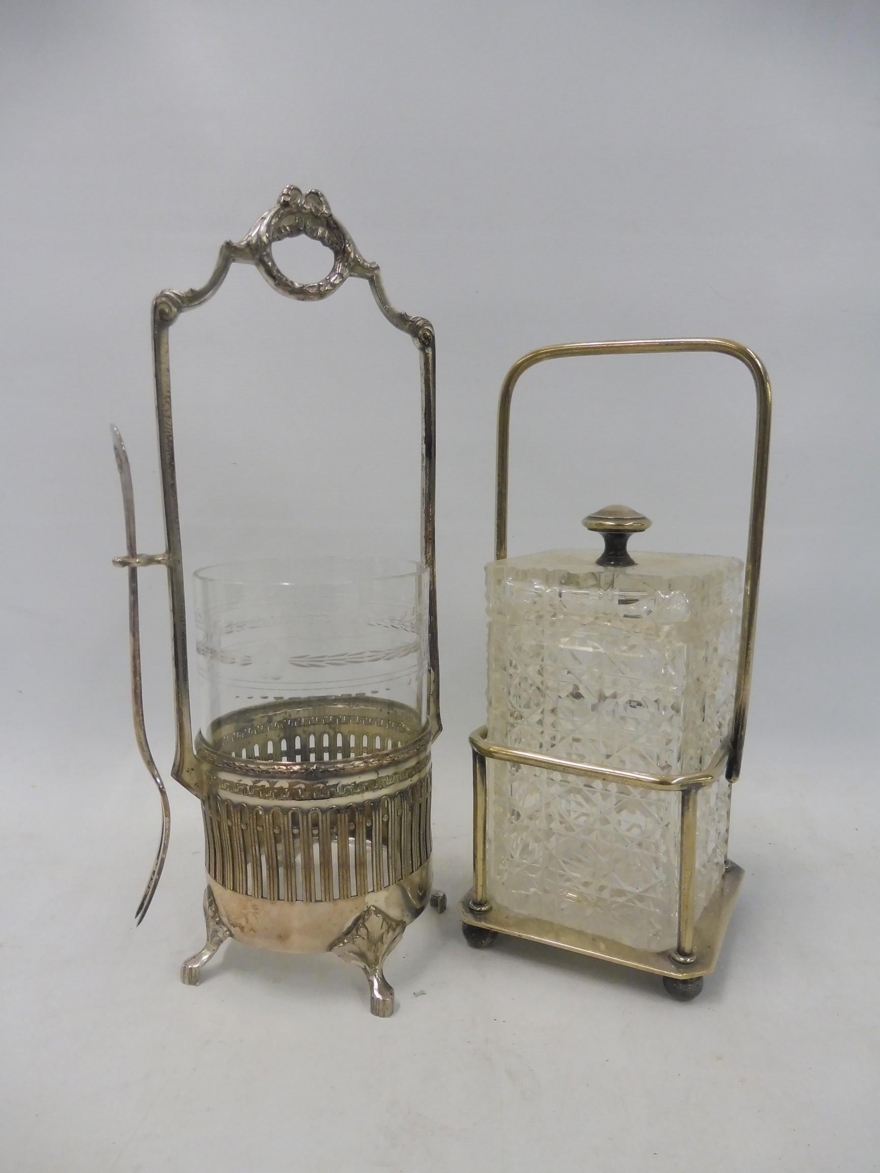 A WMF silver plated stand with glass liner and hanging pickle fork, plus a cut glass square lidded