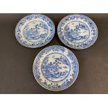 Three Chinese blue and white plates, decorated with buildings in a landscape, 19th Century, 9"
