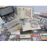 A collection of stamps, some in albums, some loose, including five penny reds.