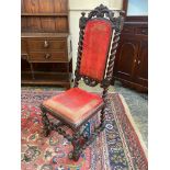 A Victorian oak side chair with barley twist supports and uprights.