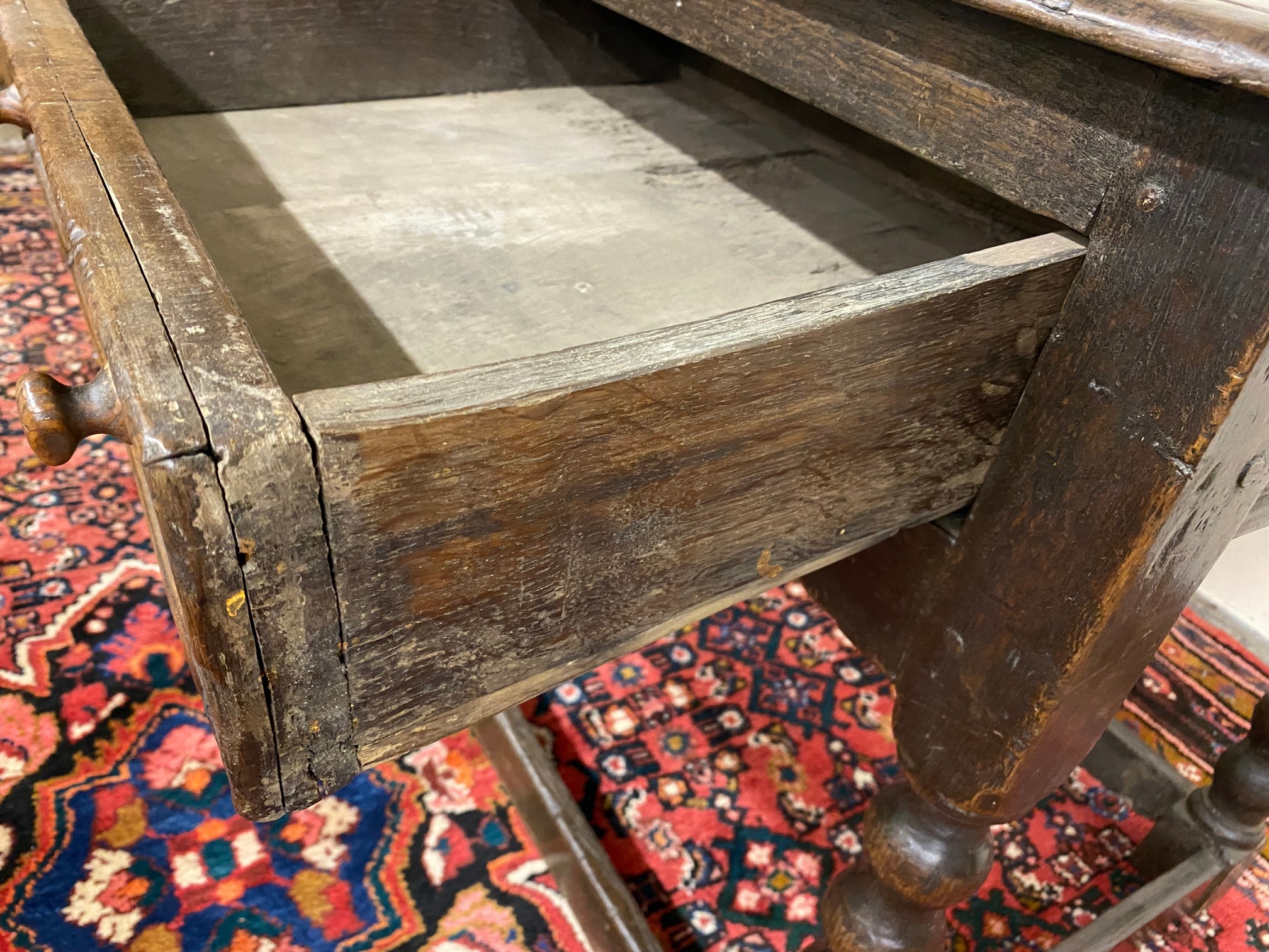 A primitive 17th Century Welsh oak side table with bobbin supports, 30 1/2" w x 26" h x 23" d. - Image 6 of 15