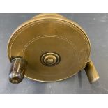 A brass 4" side caster.