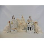 A group of 19th Century Staffordshire figures including a Scotsman stood beside his dog plus another