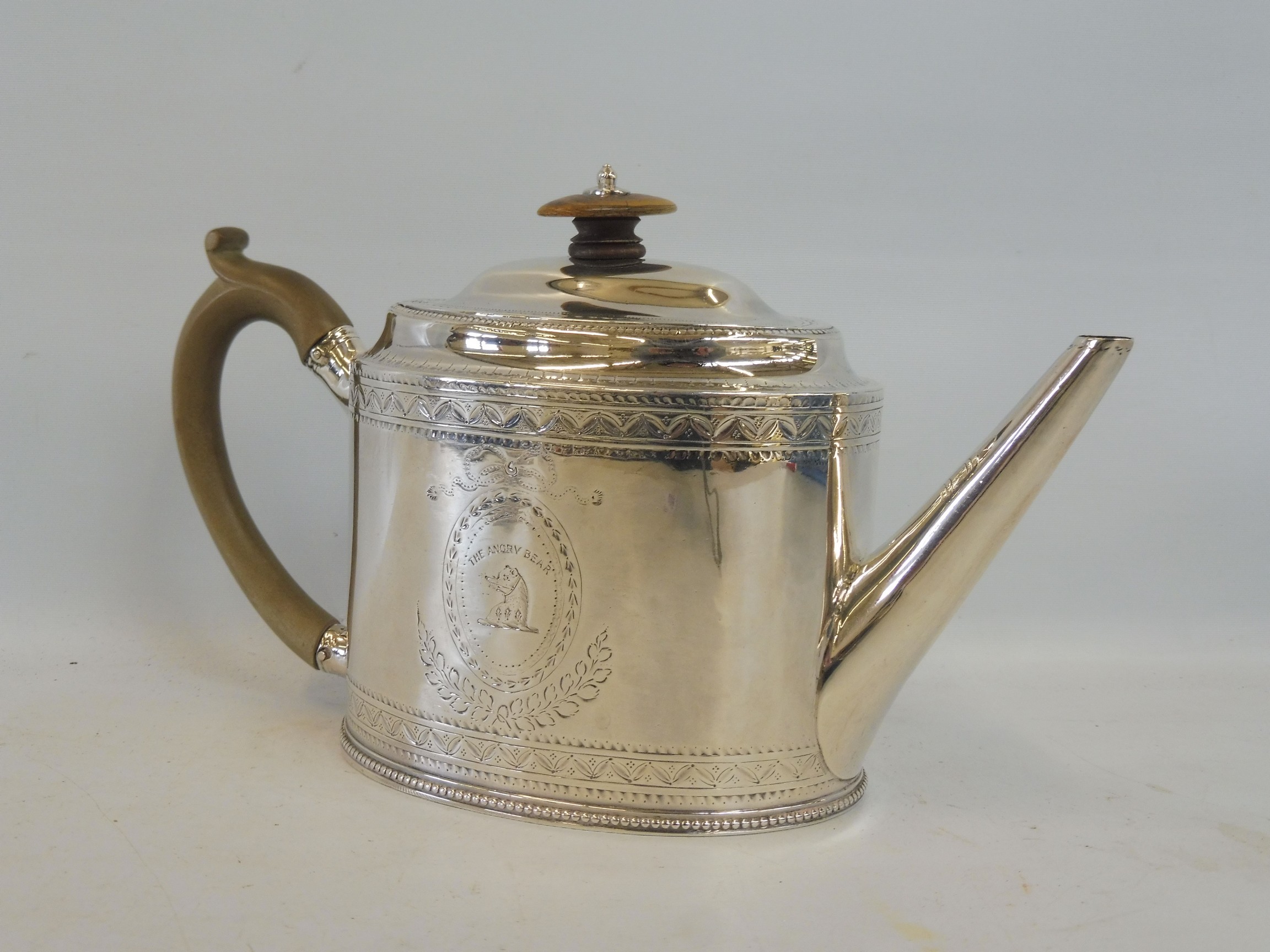 A Georgian silver teapot of oval form, with horn finial and handle, by Hester Bateman, London 1783.