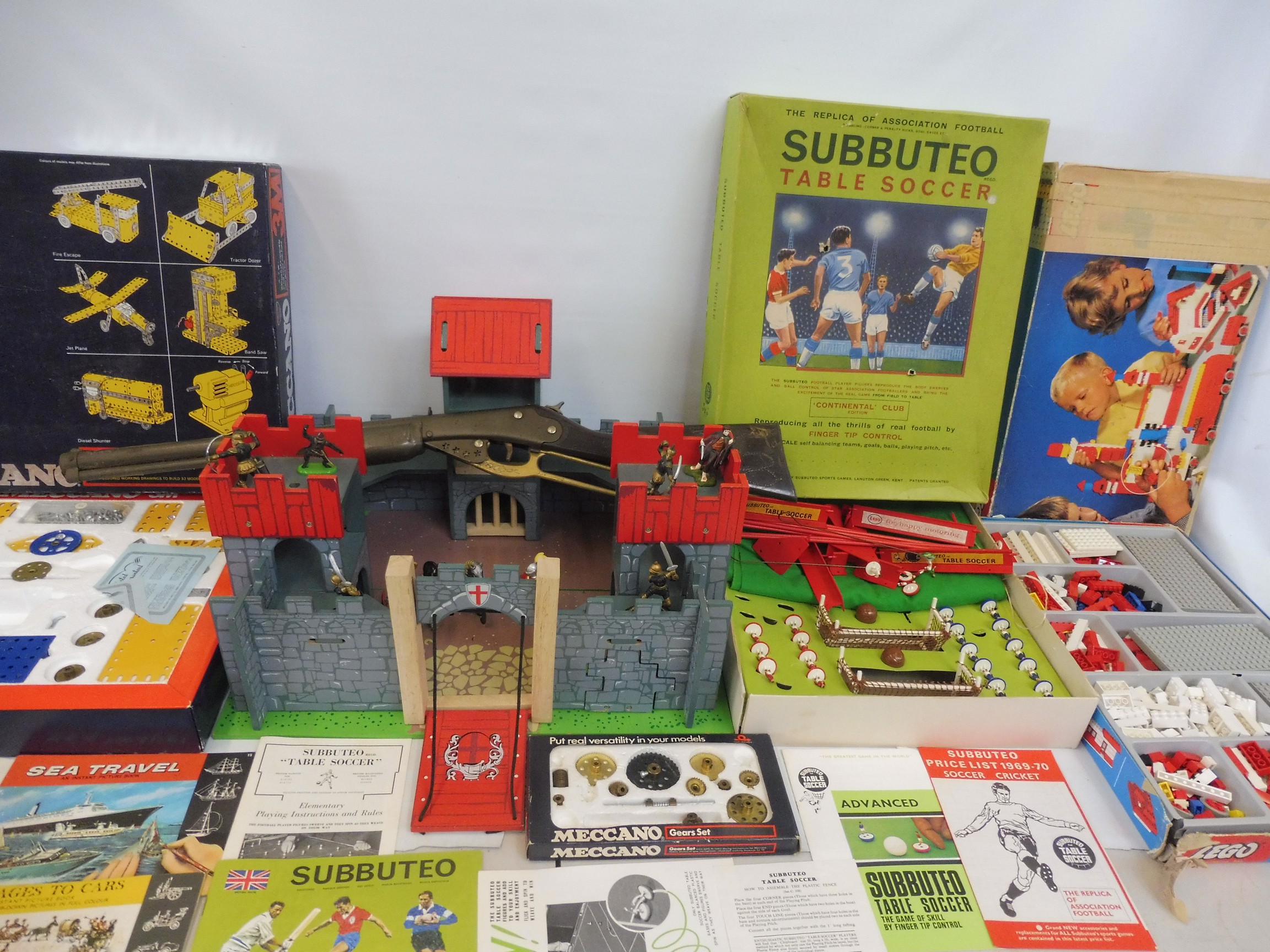 A varied selection of toys to include Lego, an early Wild West gun, a Lego builders set, Subbuteo