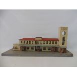 A tinplate model of a railway station, possibly German.