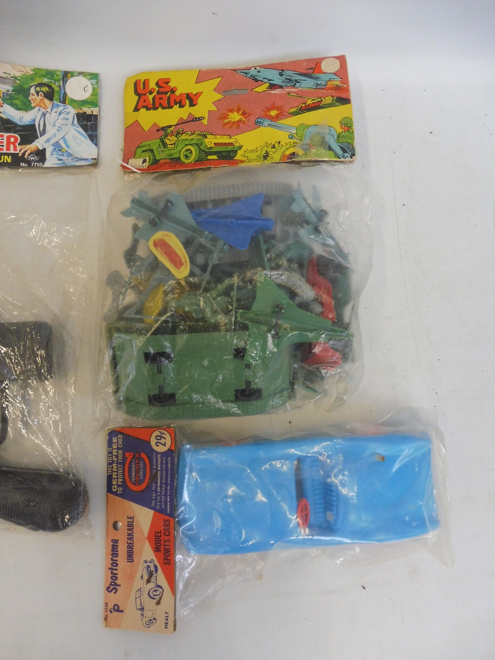 A mixed box of early plastics all sealed in original packs, including a Schmeisser sound gun. - Image 2 of 2