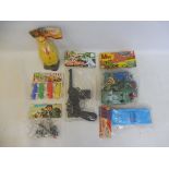 A mixed box of early plastics all sealed in original packs, including a Schmeisser sound gun.