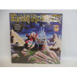 An Iron Maiden still sealed limited edition album 'First Ten Years'.